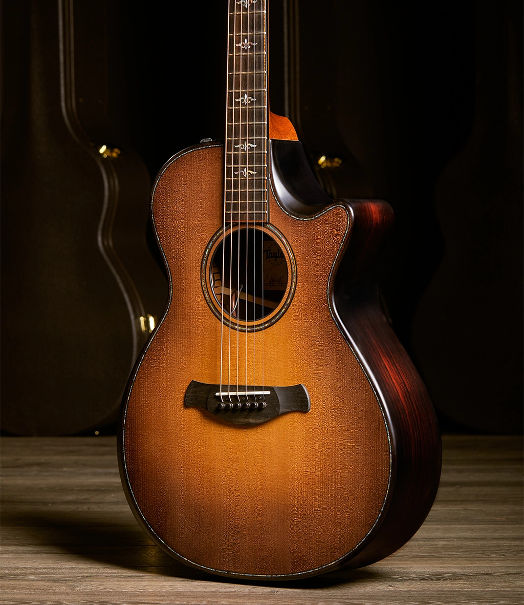 Guitar in light standing up on a wooden floor