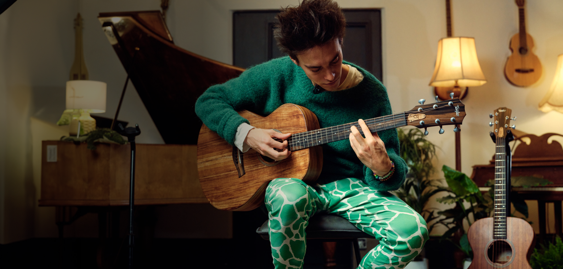 Jacob Collier playing a 6-string guitar