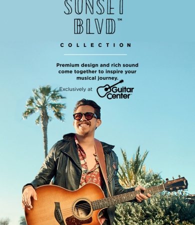 Guy holding a Sunset Blvd Guitar