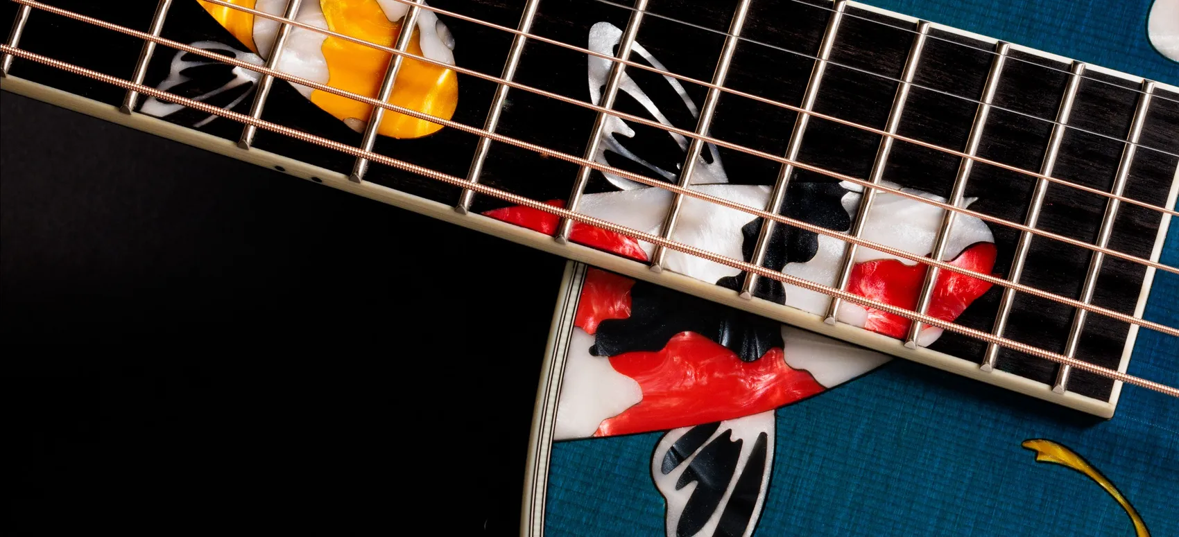A custom Taylor guitar with koi fish inlay